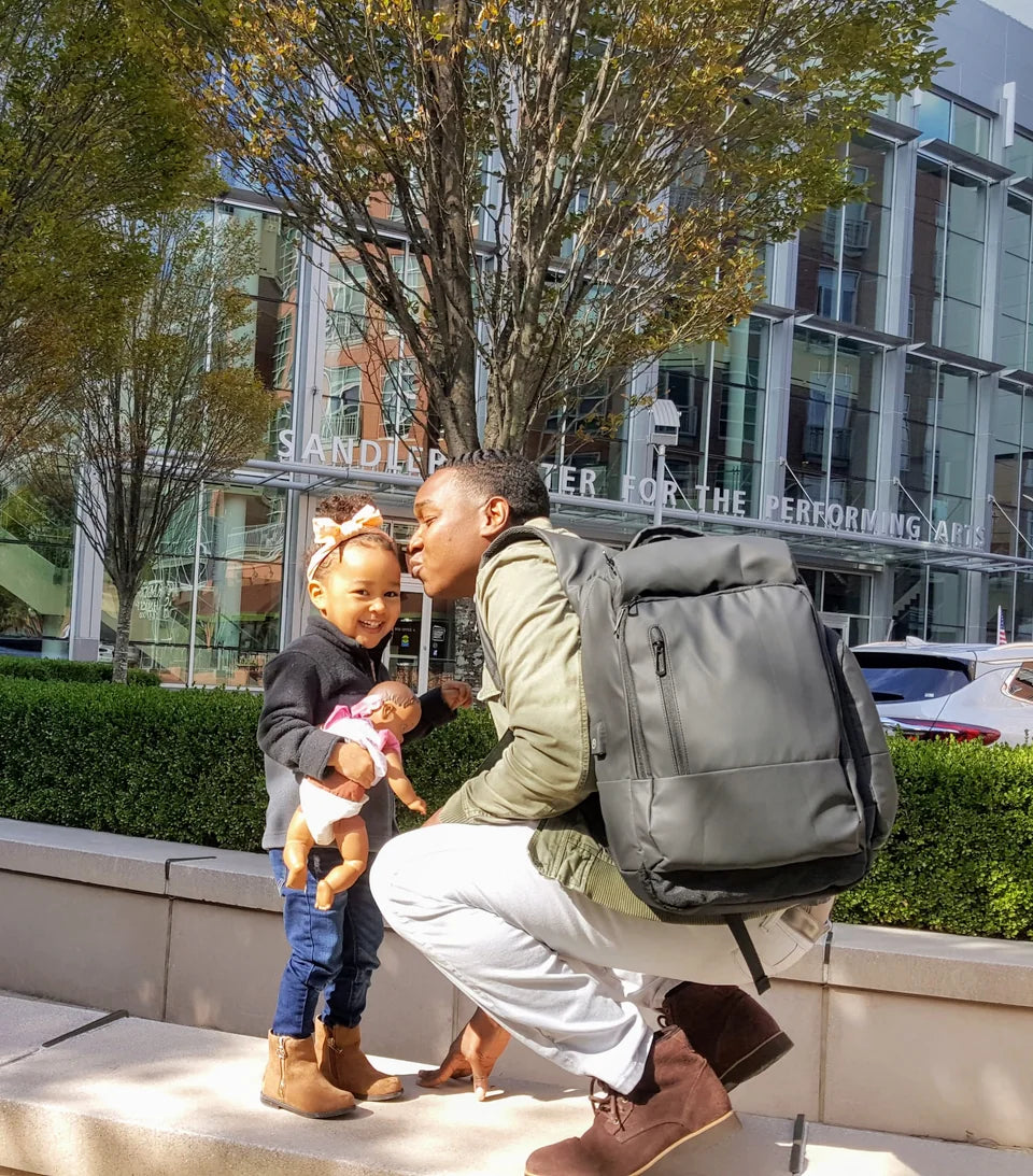Father with his daughter and Jett backpack outdoors